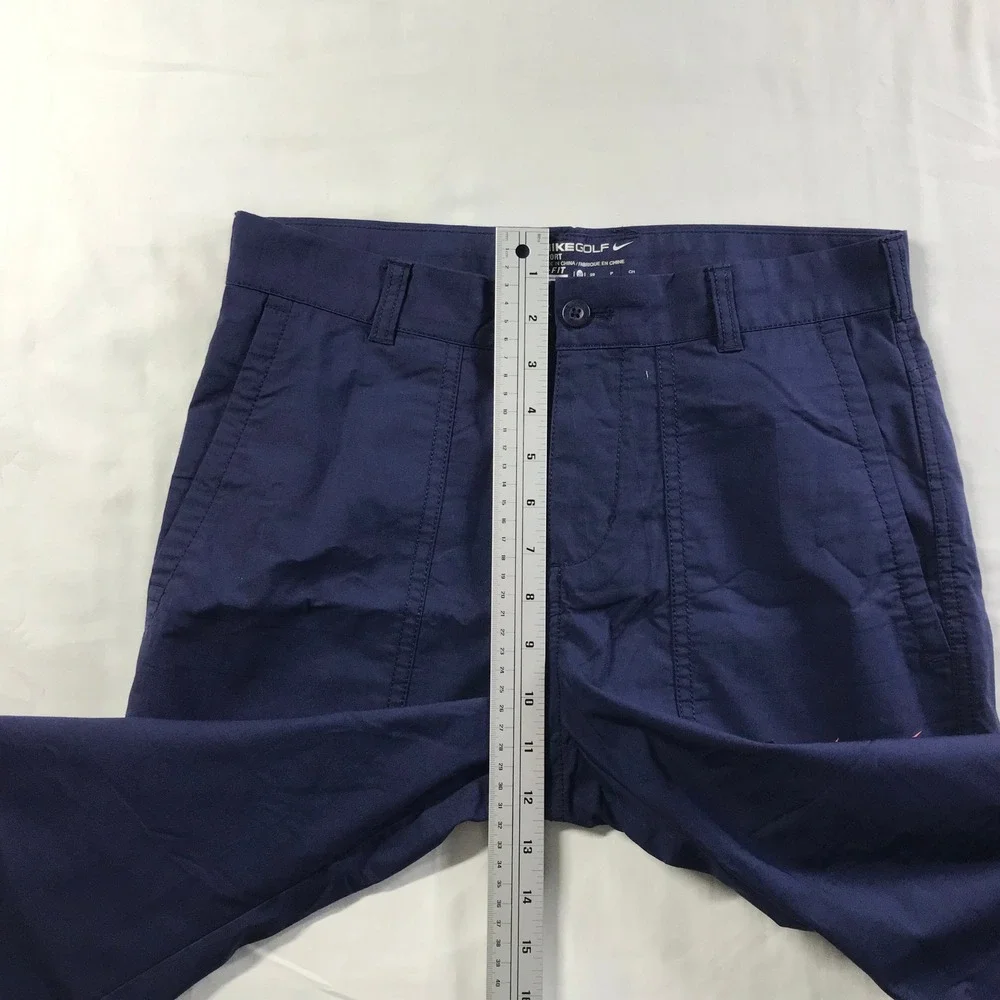 Nike Men's Navy Cargo Pants with Orange Swoosh Accent